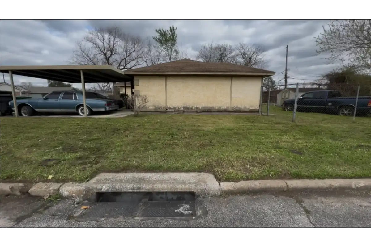 Residential lawn showing improved turf condition after lawn care service