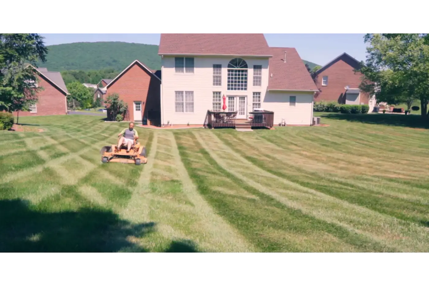 Local lawn care service helping maintain a residential property in Roanoke VA